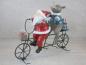 Mobile Preview: Weihnachtsmann mit Nashorn auf Fahrrad, Dekoration