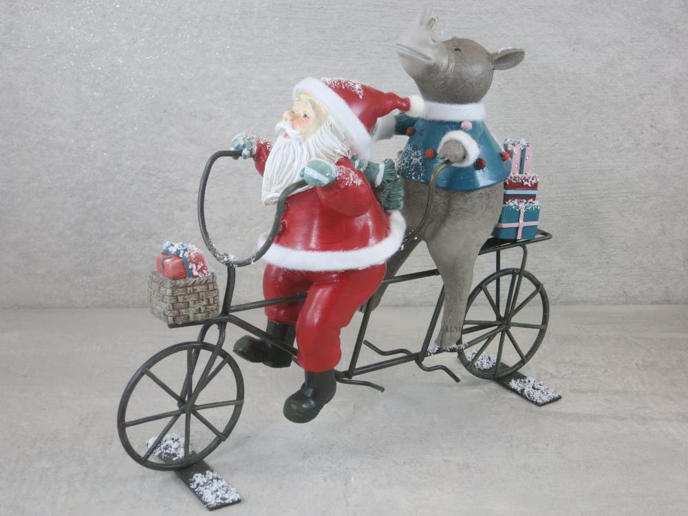Weihnachtsmann mit Nashorn auf Fahrrad, Dekoration